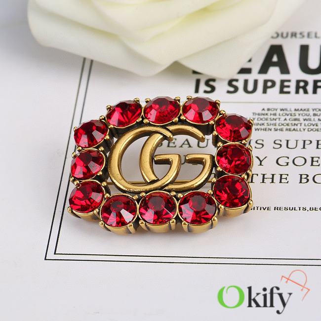 Okify Gucci's letter brooch - 1