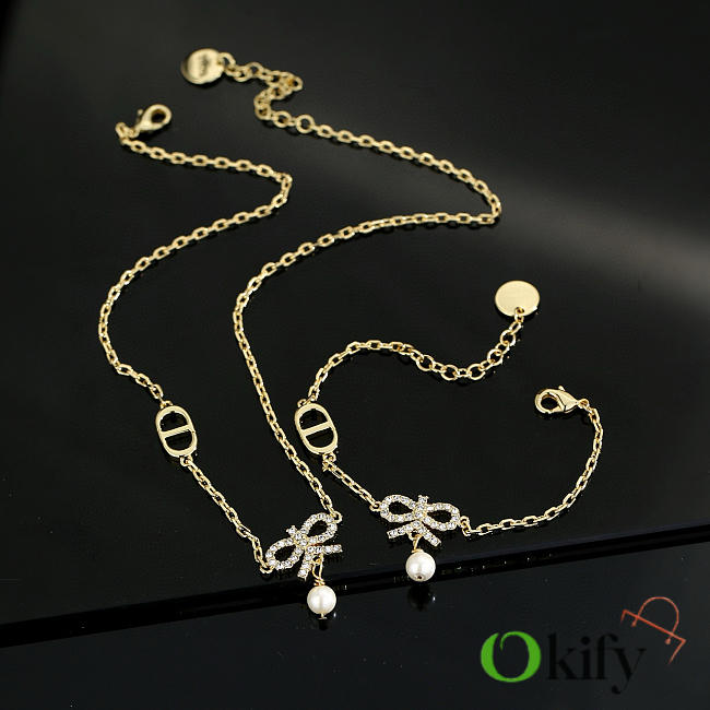Okify Dior Set Of Gold Necklace And Bracelet With Bow Charm - 1