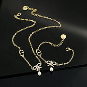 Okify Dior Set Of Gold Necklace And Bracelet With Bow Charm - 1