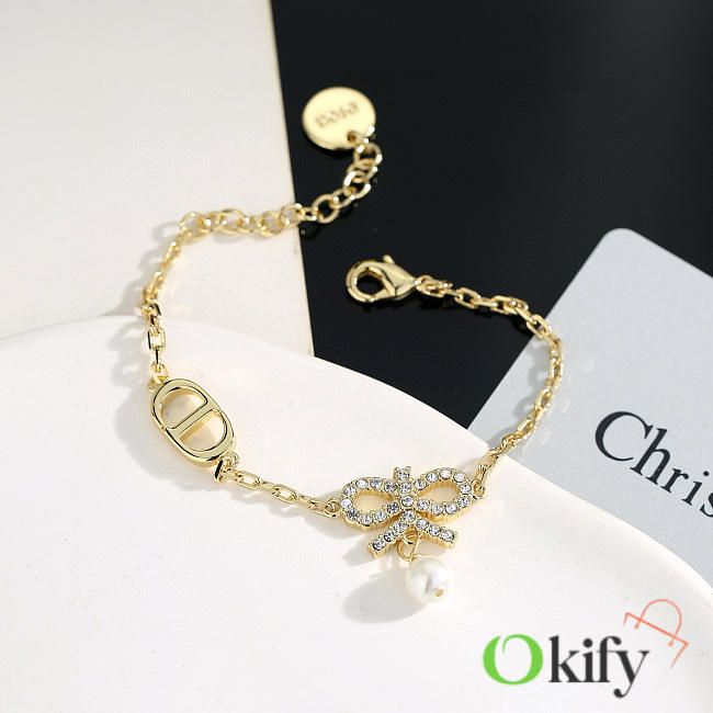 Okify Dior Gold Bracelet With Bow Charm - 1