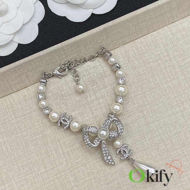 Okify CC Silver And Pearl Bracelet With Bow - 1